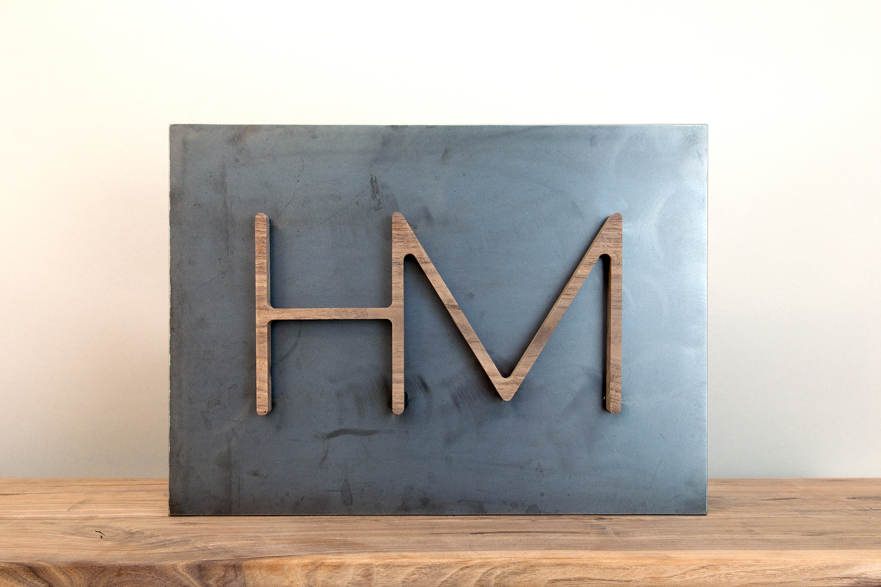 HM logo w wood letter
